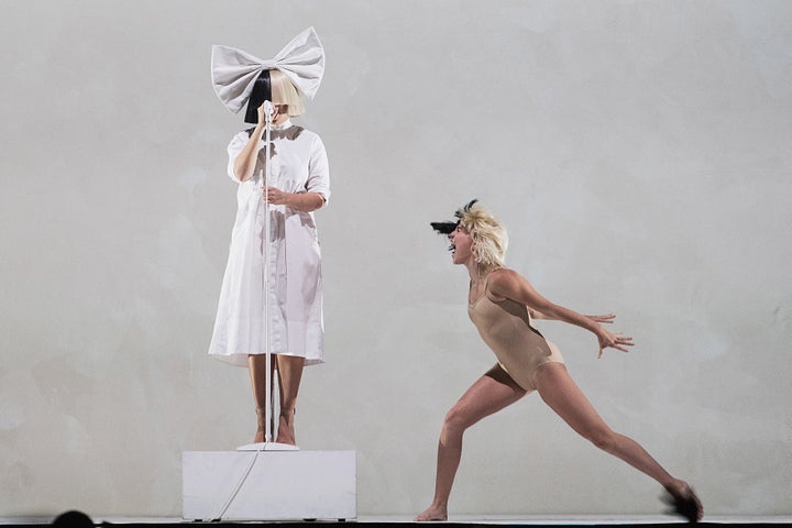 Sia and Maddie Ziegler perform on stage during the opening night of her 'Nostalgic for the Present' tour at KeyArena on Septe