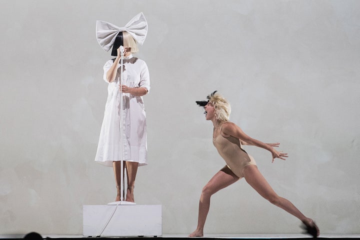 Sia and Maddie Ziegler perform on stage during the opening night of her 'Nostalgic for the Present' tour at KeyArena on September 29, 2016 in Seattle, Washington.