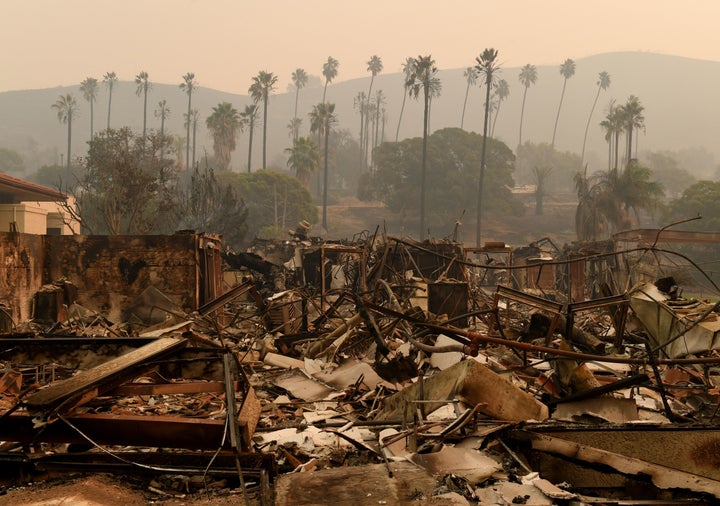 Trees are seen through the haze at the burn-out Vista del Mar Hospital after the Thomas wildfire swept through Ventura on Wednesday.