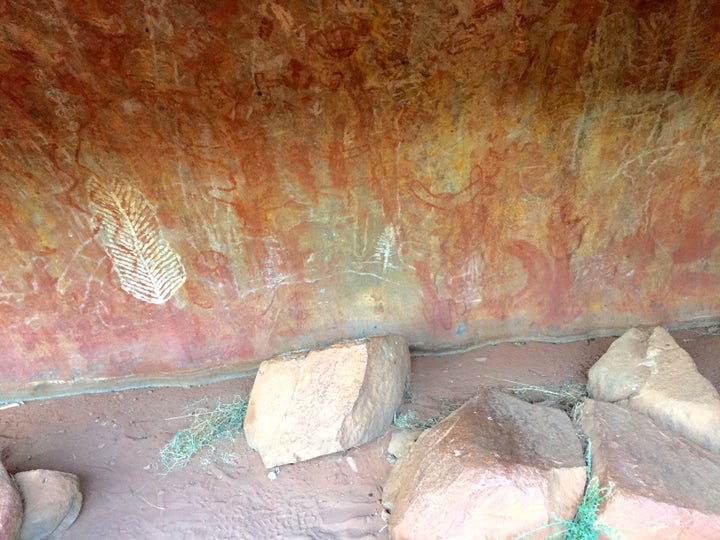 <p><strong>Ancient Rock Art At Uluru</strong></p>