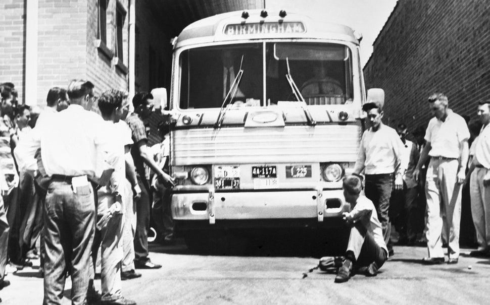 A mob of Klansmen gathers at the Anniston bus terminal.