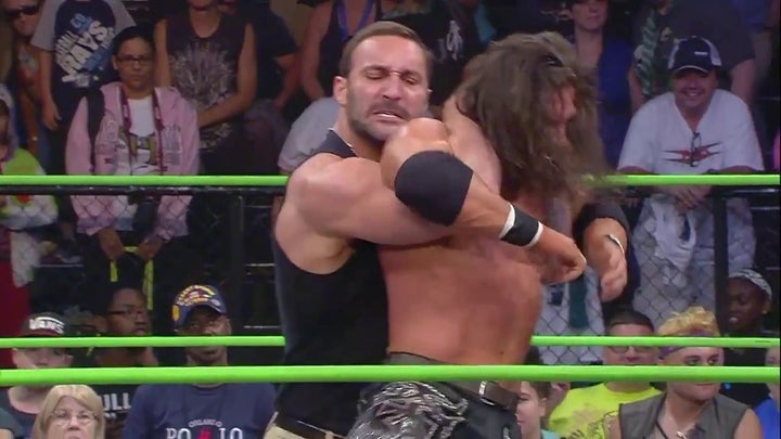 Chris Adonis applies the “Adonis Lock” on Impact Wrestling No. 1 contender Johnny Impact. 