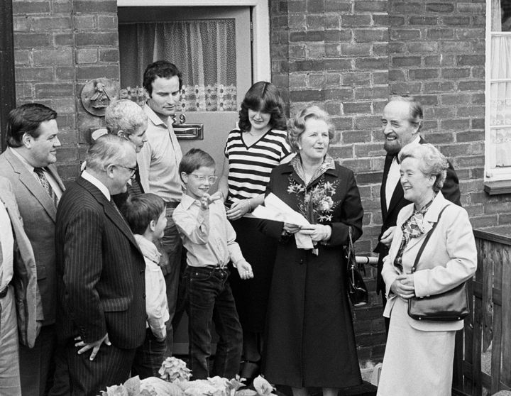 Margaret Thatcher hands over a copy of the deeds of 39 Amersham Road, Harold Hill, in Essex, to a young couple in 1980 on the day of right-to-buy's launch