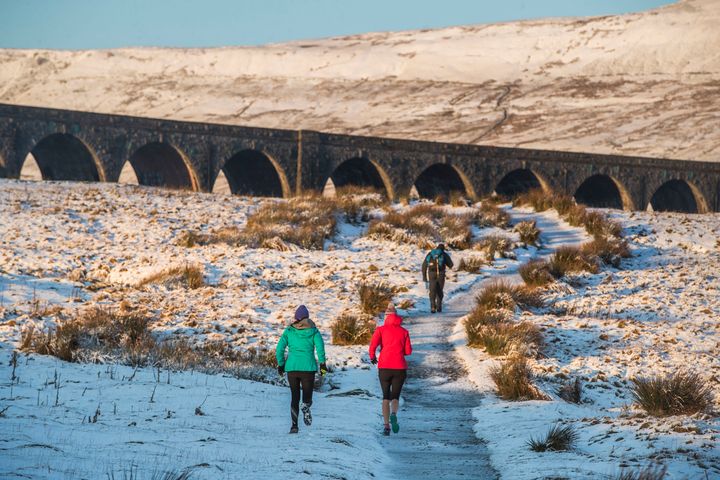 Walkers at Ribblehead Viaduct in Yorkshire 