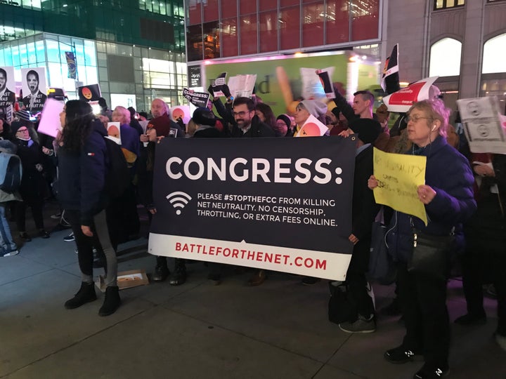 Net neutrality supporters gather at a rally in front of a Verizon store on 42nd Street in New York City on Dec. 7.