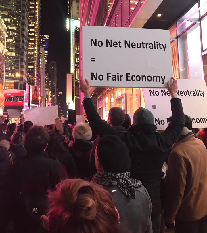 Net neutrality supporters gather at a rally in front of a Verizon store on 42nd Street in New York City on Dec. 7.