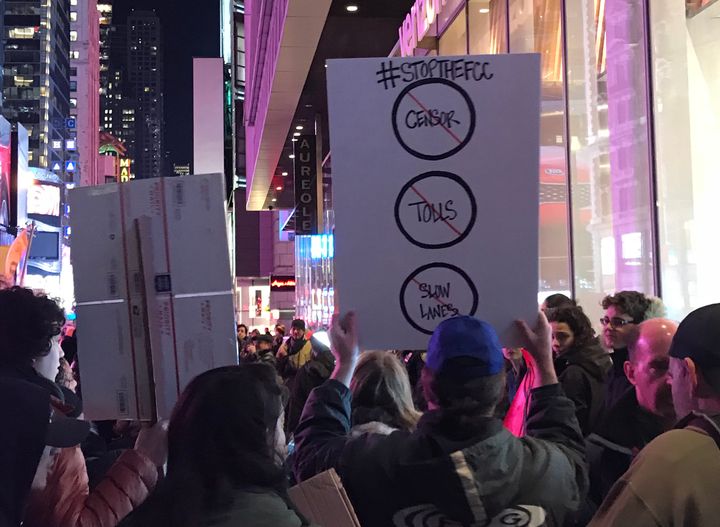 Net neutrality supporters gather at a rally in front of a Verizon store on 42nd Street in New York City on Dec. 7.