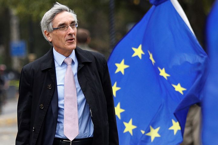 Despite being photo-bombed by this EU flag, John Redwood is a veteran Tory eurosceptic. 