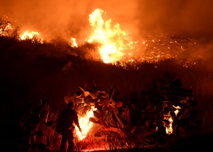 Firefighters battle the Santa Ana wind-driven Thomas fire near Ventura, California, on Dec. 5, 2017.