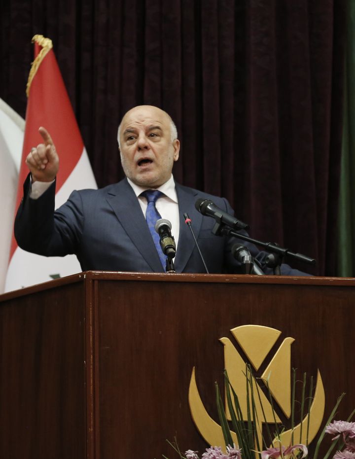 Haider al-Abadi delivers a speech during an international media conference in Baghdad