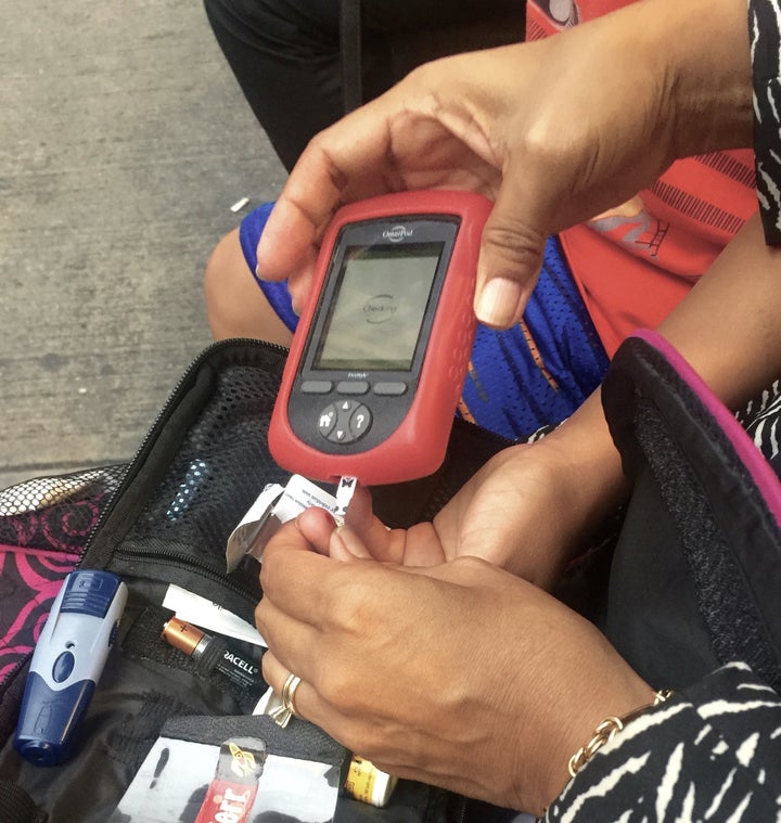 Blood sugar check at a pizzeria in New York City before dinner.