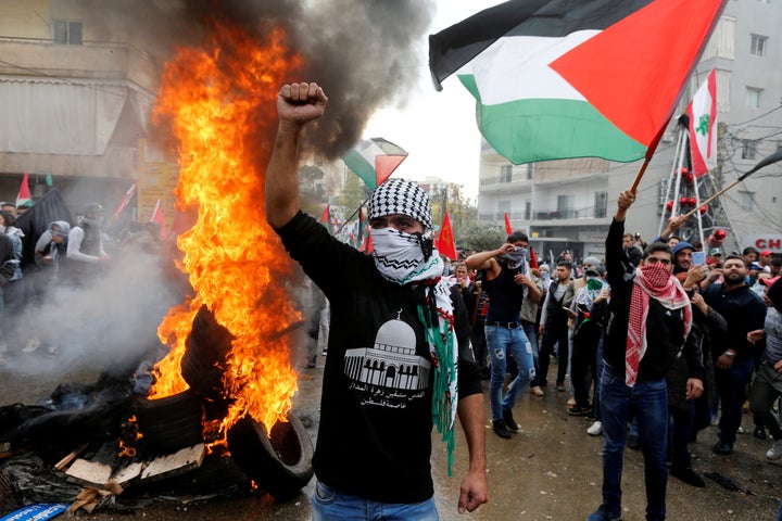 Protesters are seen near the U.S. embassy in Awkar, north of Beirut, Lebanon on December 10, 2017. (REUTERS/Mohamed Azakir)