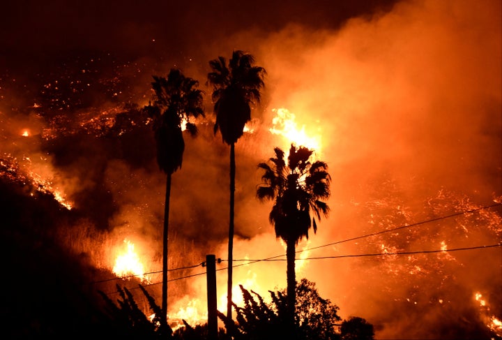 Flames spread in a valley from a Santa Ana wind-driven brush fire called the Thomas fire near Ventura, California, on Dec. 5, 2017.