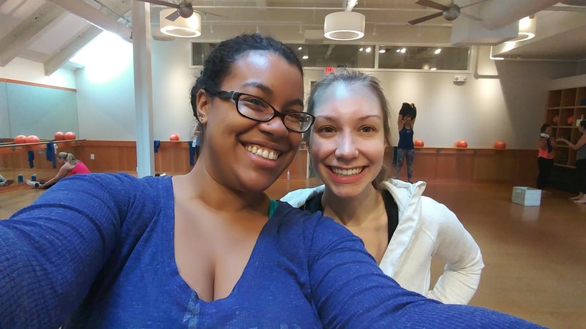 A photo of me (left) and my good friend excited before our workout in the larger studio room.