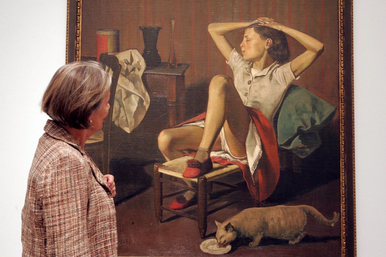 A woman looks at Balthus' “Thérèse Dreaming."