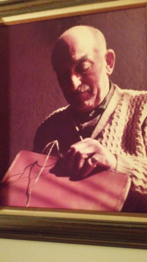 <p><strong><em>Captain Lee at his leisure, sewing his son John’s attaché case</em></strong></p>