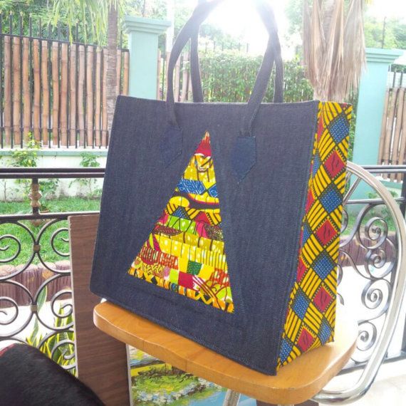 Denim, prints and color lend this tote an exotic appeal. Definitely a must-have piece !