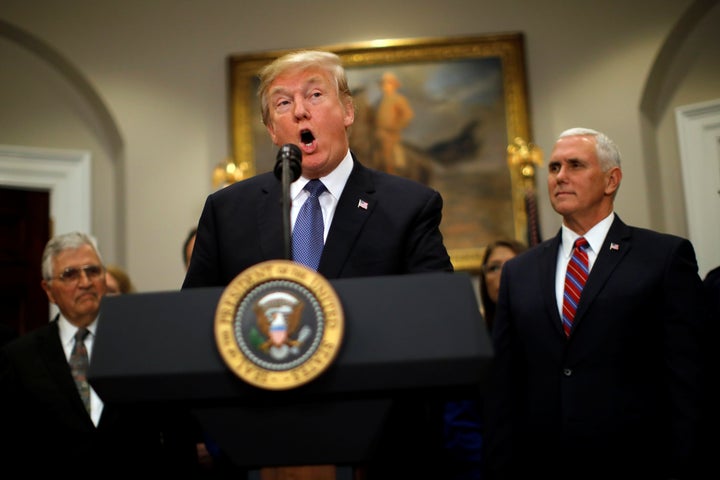 President Donald Trump pictured in the White House on December 11, 2017. Trump was not invited to attend a global climate conference that's being held in Paris this week. 