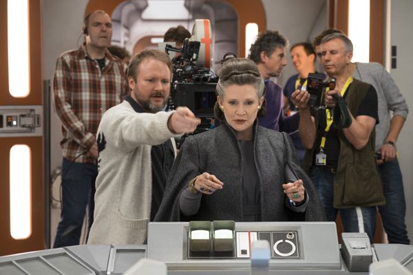 L to R: Director Rian Johnson with Carrie Fisher (Leia) on set.