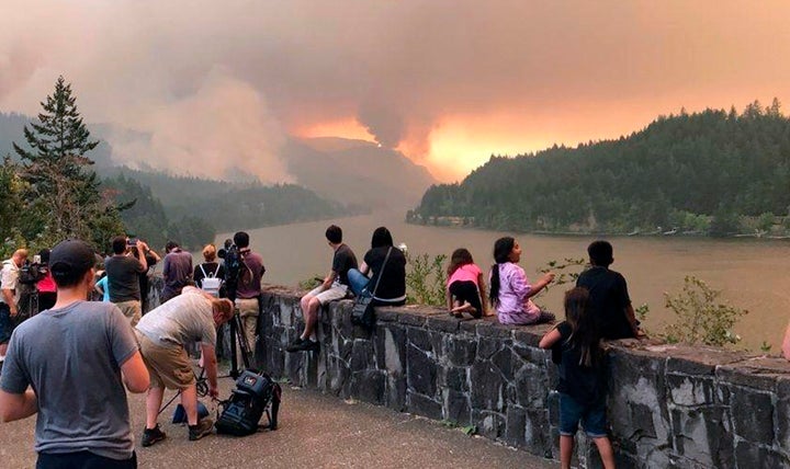 Bystanders watch the Eagle Creek fire burn in Oregon on September 4, 2017.