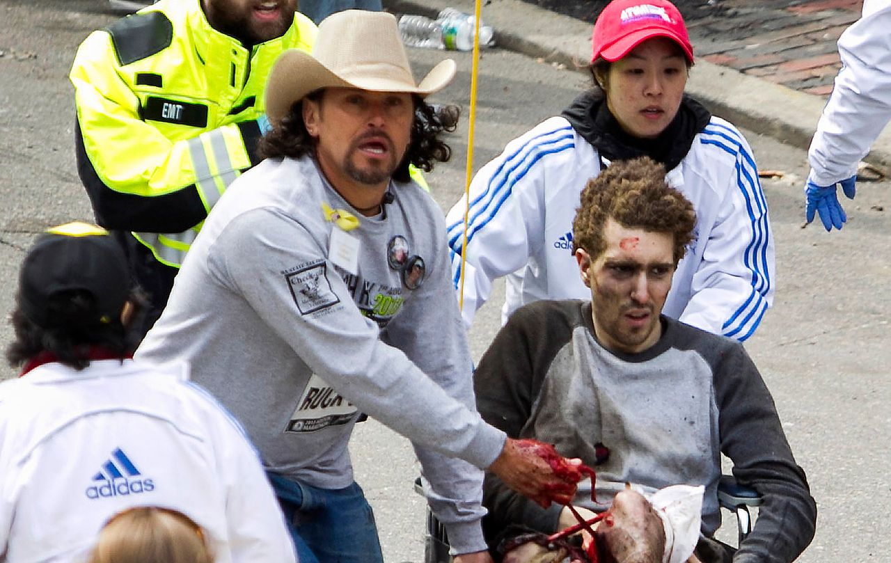 First responders including Carlos Arredondo, in the cowboy hat, tend to Jeff Bauman, who was severely wounded after two explosions occurred along the final stretch of the Boston Marathon in 2013.