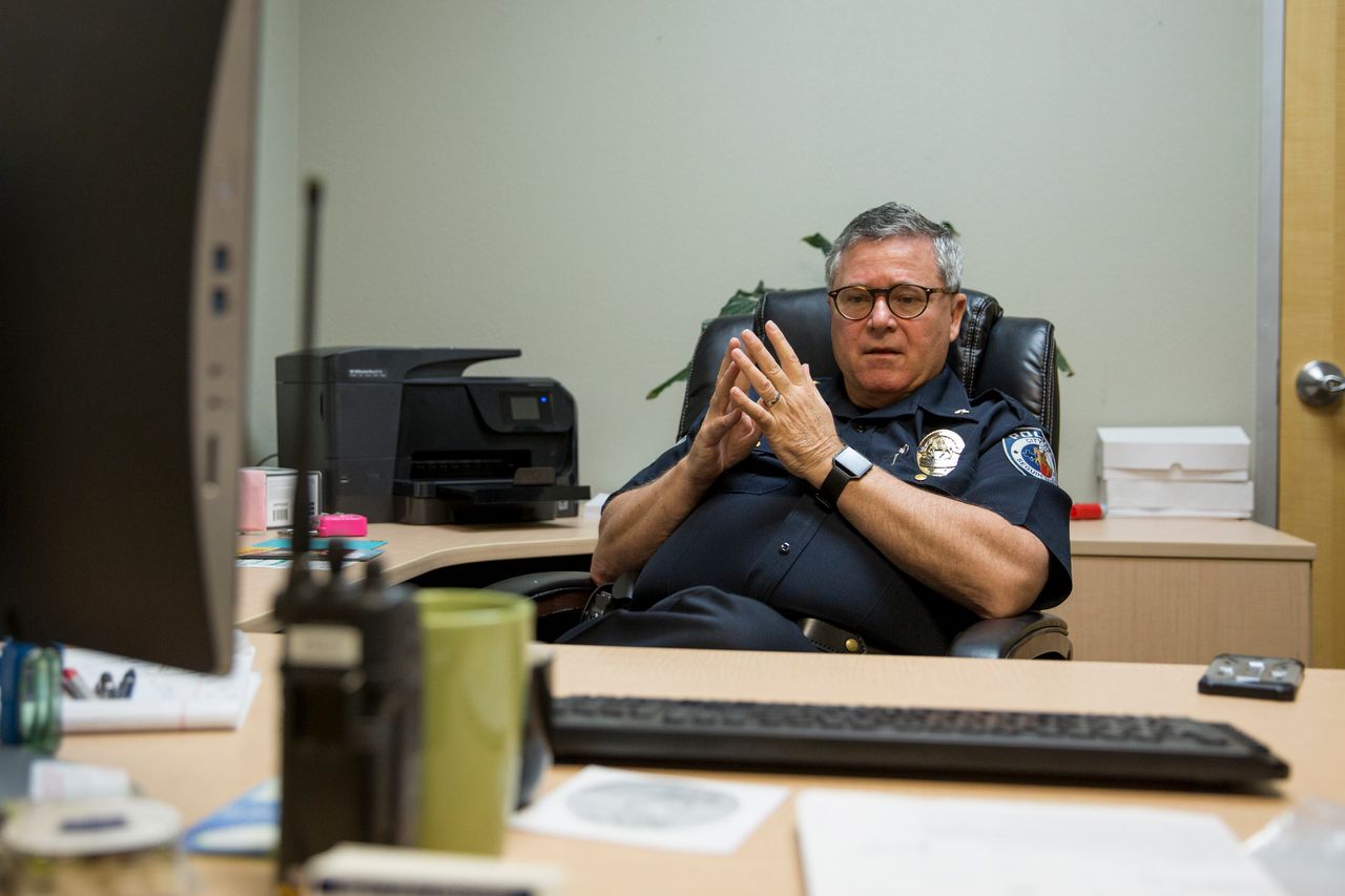 Bruce Ure back at his desk as deputy chief of the police department in Seguin, Texas.