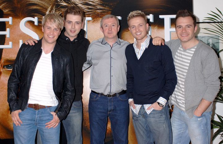 Louis looking his usual happy self with the Westlife boys in 2006