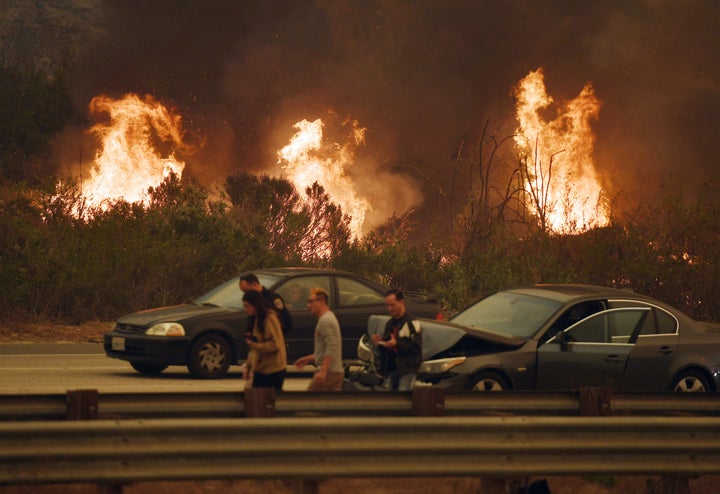 A wall of flames beside the 101 highway near Ventura, California on Dec. 6, 2017.<br><br>Homeowners living in fire-prone area