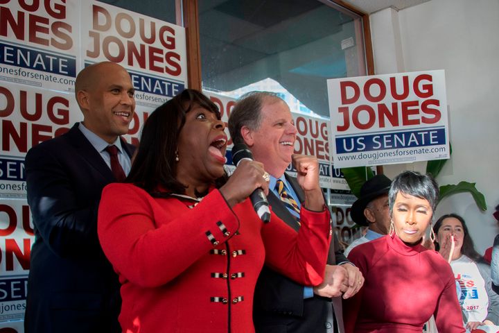 Doug Jones campaigning on Sunday with Democratic Rep. Terri Sewell of Alabama (holding microphone) and Democratic Sen. Cory Booker of New Jersey (left).