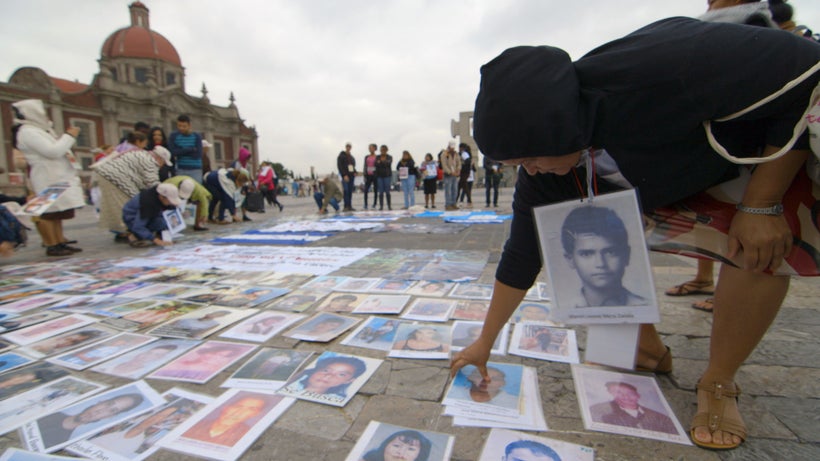 A mother picking up pictures in Basilica