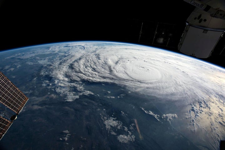 Hurricane Harvey, seen here in a photo taken from the International Space Station, was made worse by climate change, scientists said Wednesday.