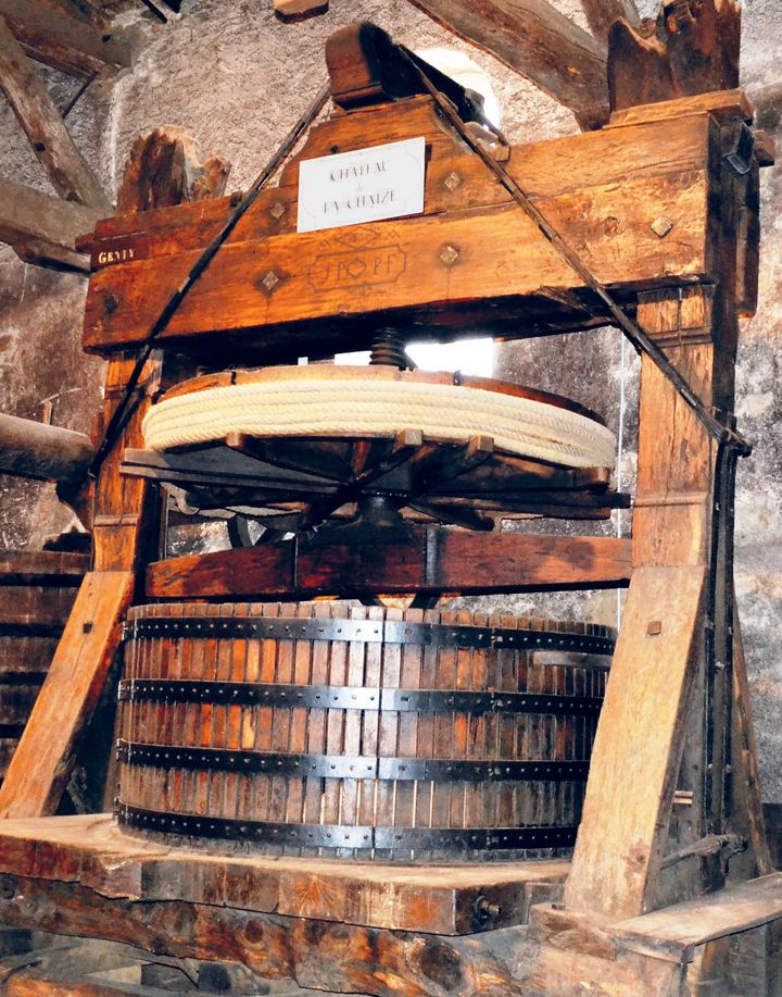 An antique wine press at Chateau de la Chaize in Rhône, France 