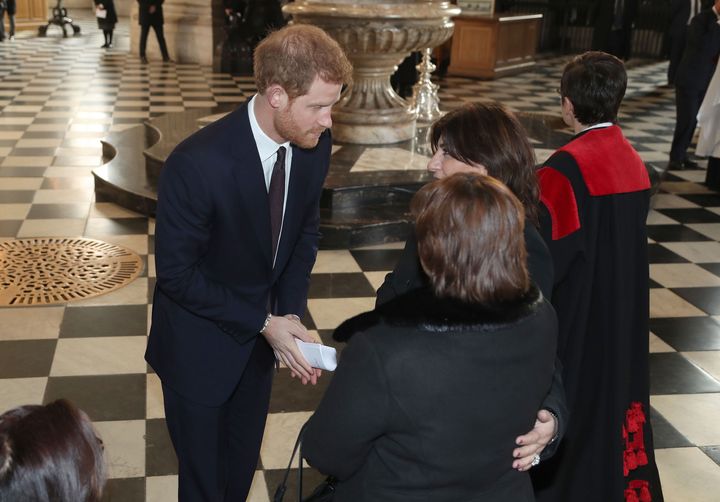 Prince Harry meets with families after leaving after the memorial