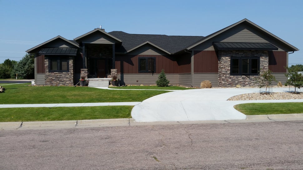 Jim Spencer died in a trench collapse while helping build this house in Alliance, Nebraska, last year. The small evergreen tr