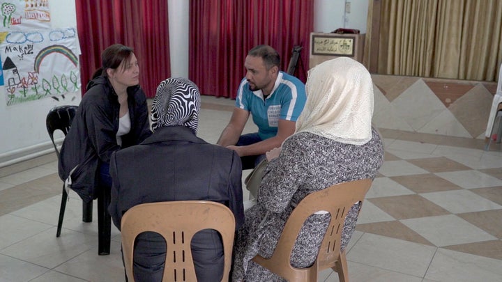 Aiysha, right, with her grandmother, Najat, left, speaking to HuffPost reporters with Unicef