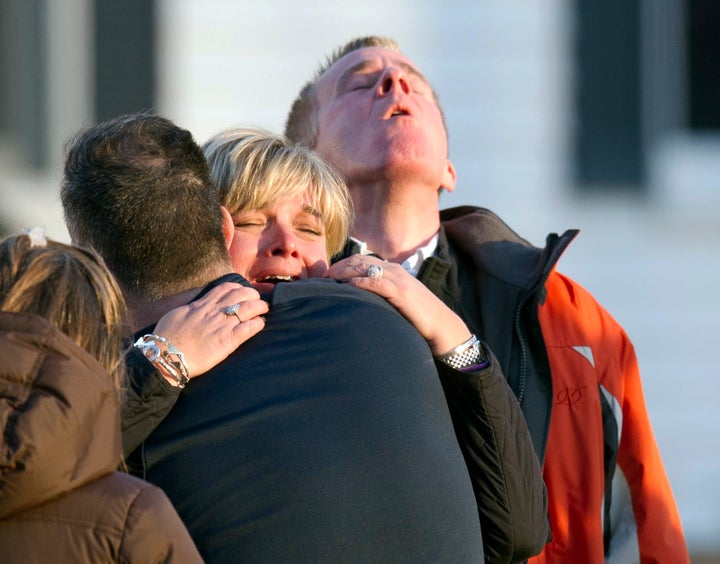 Distraught leave the fire station after hearing news of their loved ones from officials December 14, 2012 in Newtown, Connecticut. 