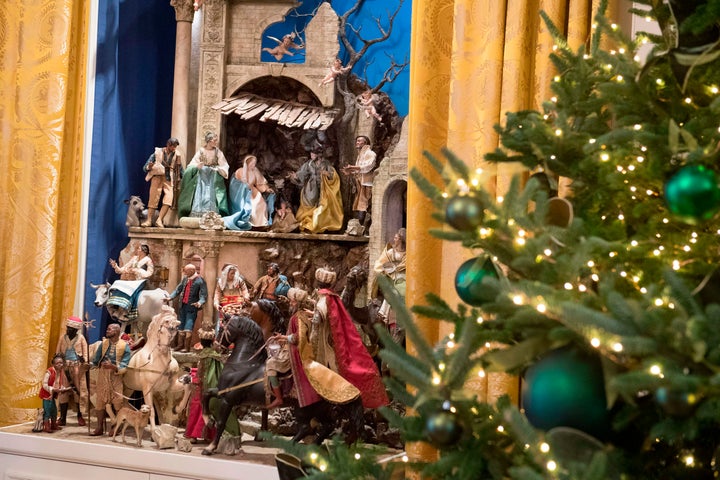 A Nativity scene and Christmas trees are seen during a preview of holiday decorations in the East Room of the White House, Nov. 27, 2017