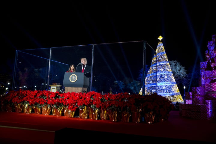 U.S. President Donald Trump, right, speaks as first lady Melania Trump attends the 95th Annual National Christmas Tree Lighting in Washington, on Thursday, Nov. 30, 2017.