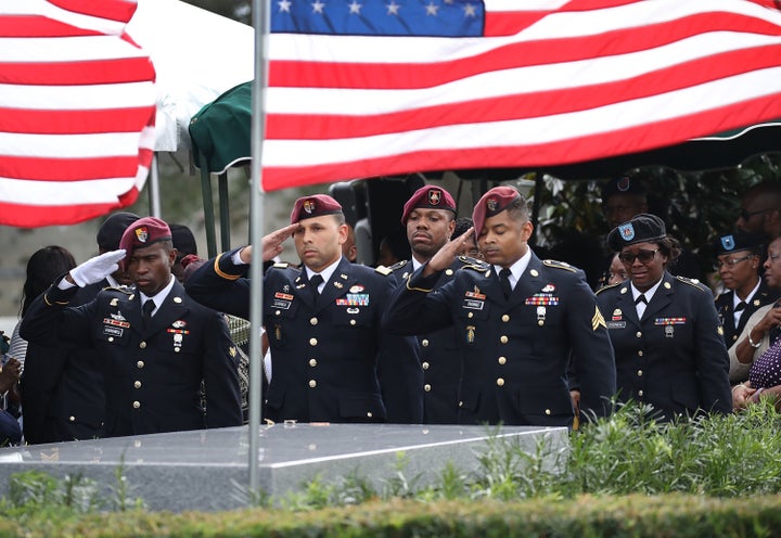 Members of the 3rd Special Forces Group salute the casket of U.S. Army Sgt. La David Johnson at his burial service on October 21, 2017. Johnson and three other American soldiers were killed in an ambush in Niger on Oct. 4.