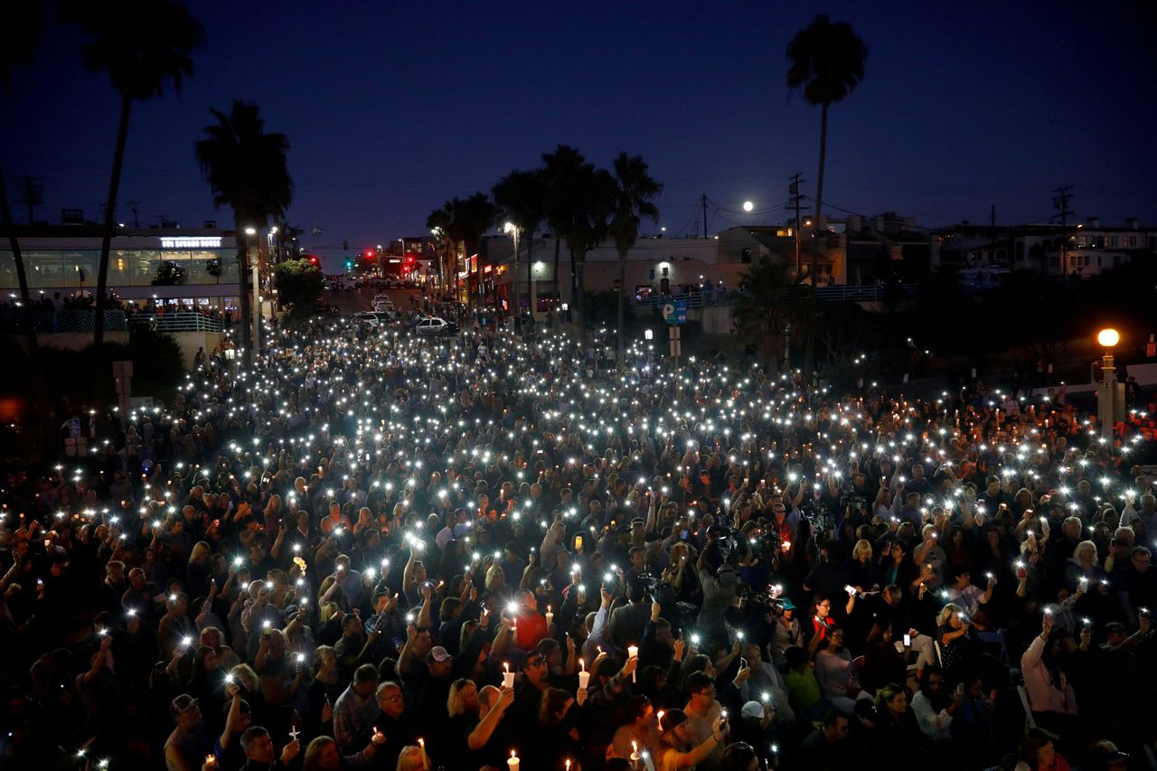 People in Manhattan Beach, California, hold a vigil for victims of the shooting in Las Vegas on Oct. 1, 2017.