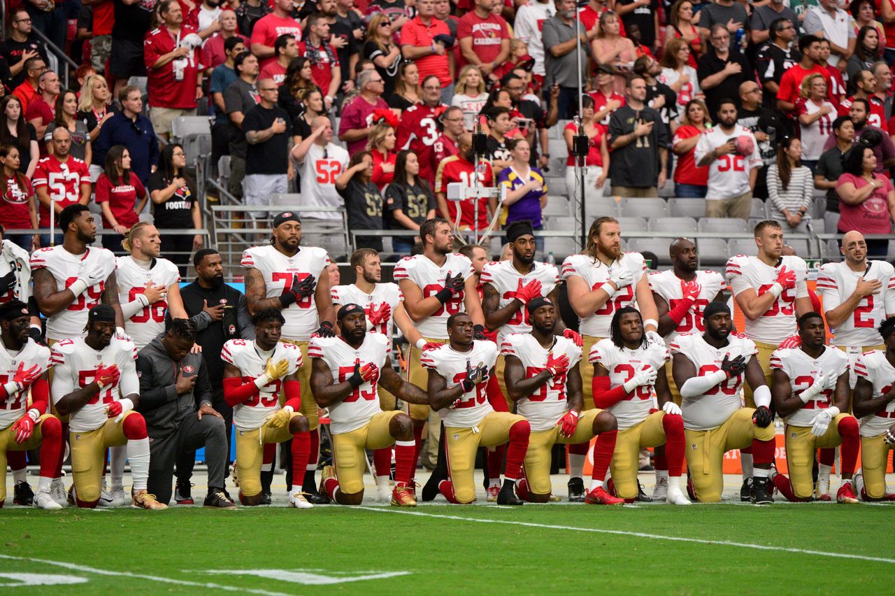 Members of the San Francisco 49ers kneel during the national anthem on Oct. 1, 2017 in Glendale, Arizona.