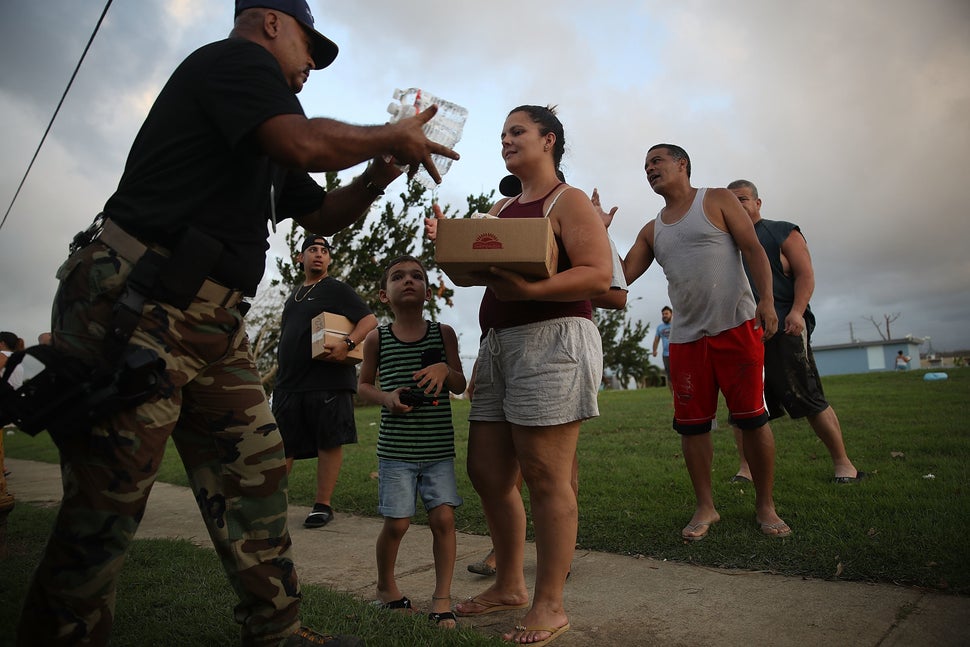 Hurricane survivors receive supplies on Sept. 28, 2017 in Toa Baja, Puerto Rico.