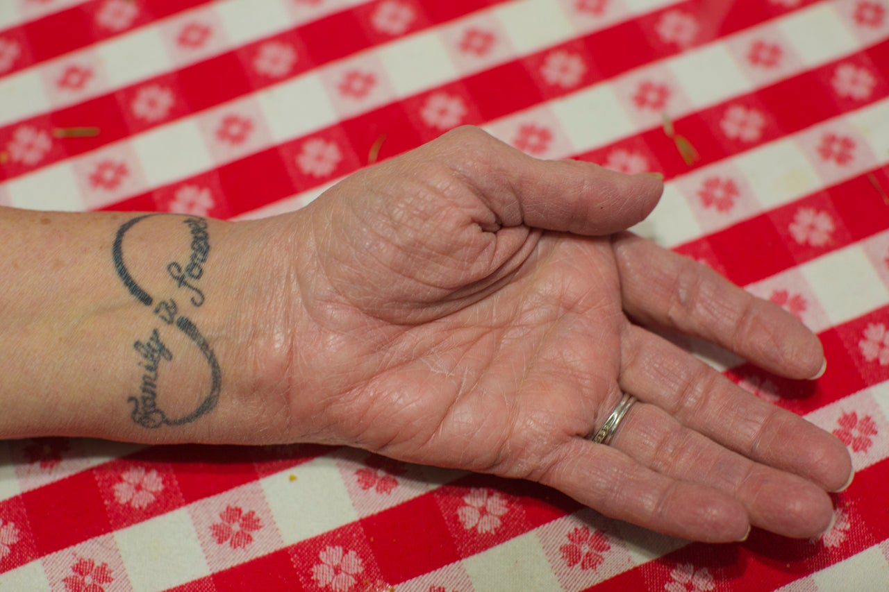 Doris Thompson, 74, Sunnie's guardian, shows a tattoo she got four years ago that says, "Family is forever."