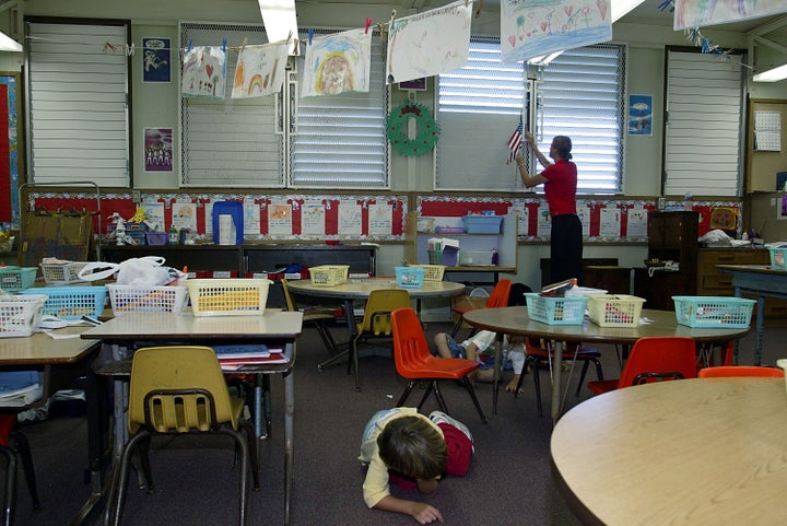 In this file photo from 2003, students in Hawaii participate in a classroom lockdown drill. 