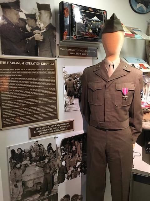 The Staff Sergeant Mike Strang orphan evacuation display, which is to the left side of the exhibit.