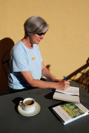 Nancy writing diligently in her journal.