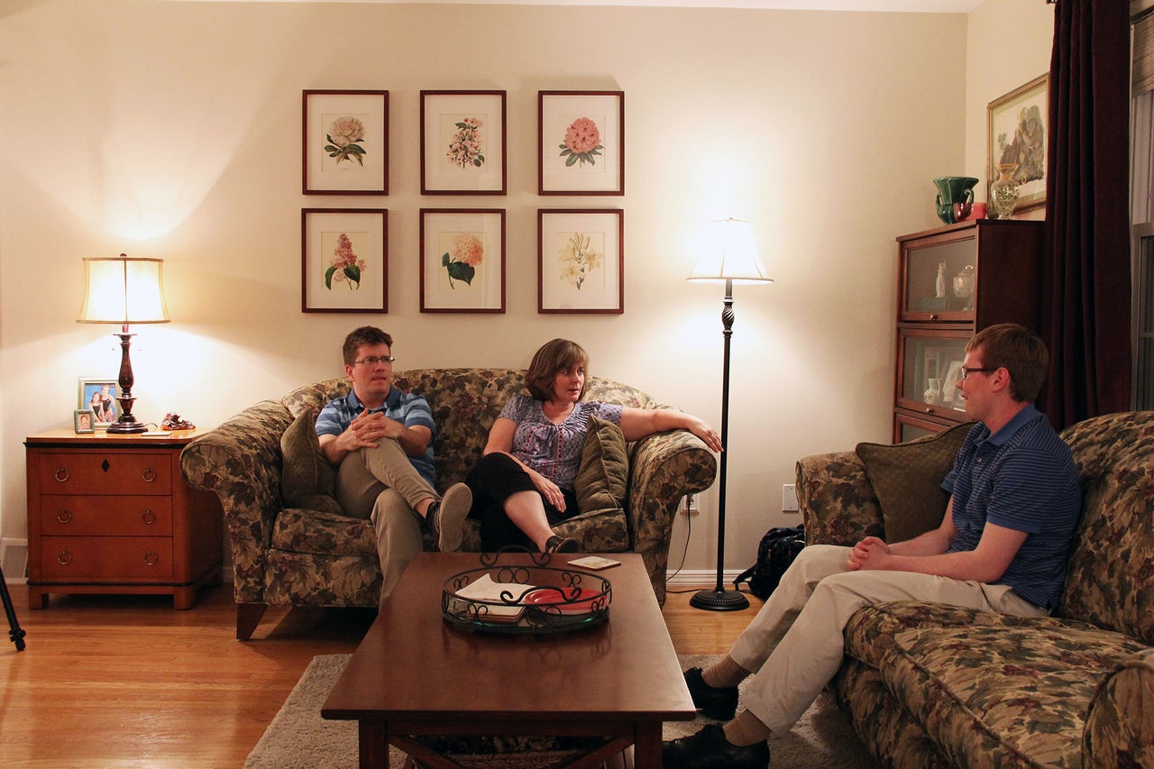 Peter O'Halloran sits with his family in their house in the suburbs of Philadelphia. He is saving money to buy his own home.