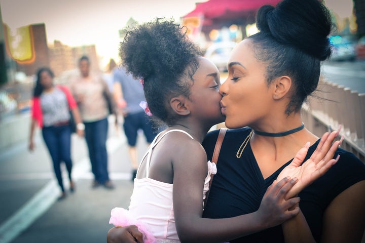 <p>Beautiful mother and daughter sharing love. </p>
