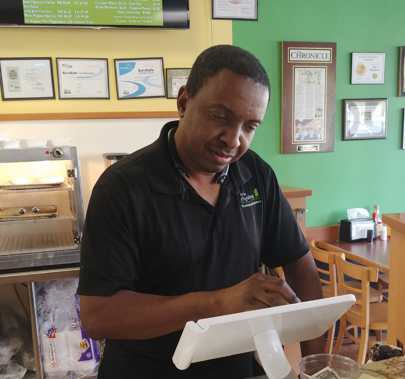 Warren Moore, a successful blind entrepreneur, at his restaurant in Winston-Salem, N.C.