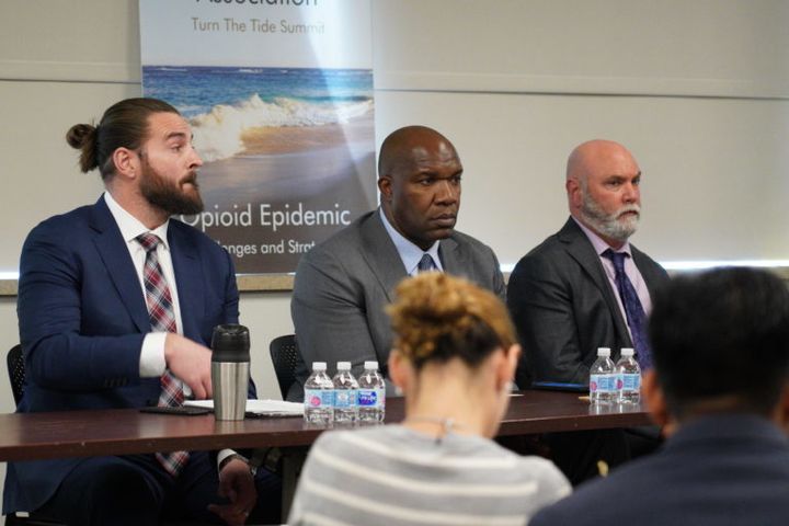 Former DEA Special Agent and President of The TITAN Group, Jack Teitelman (right), at the American Pain Association’s Turn The Tide Summit (Cooper Medical School of Rowan University ) with Former NFL Offensive Lineman, Todd Herremans (left), commented on the opioid crisis with fellow Athletes For CARE Ambassadors, Super Bowl champion Marvin Washington (center). 